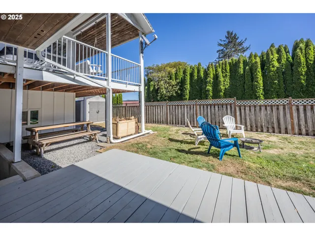 a view of balcony with wooden floor and outdoor seating