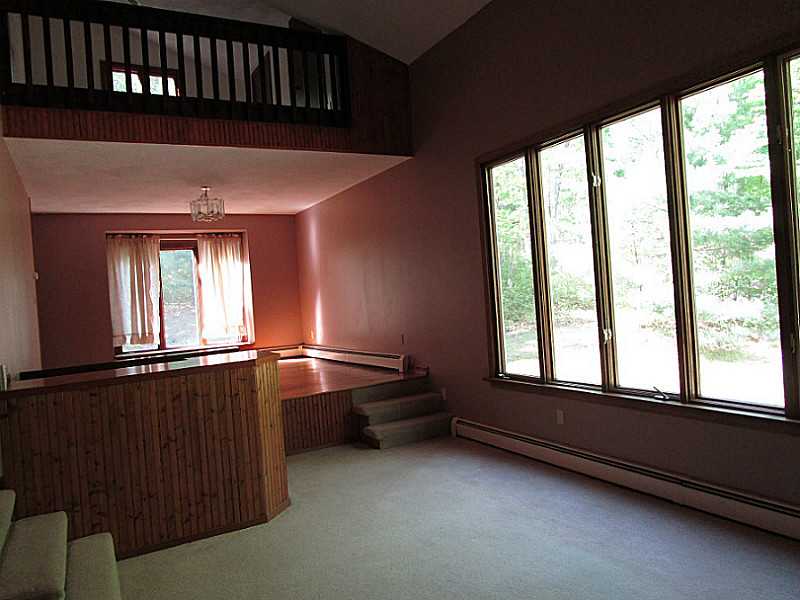 86 Bramble Bush Road Coventry, RI 02816 - Photo 3 of 25 Living Room. LIVING/DINING AREA MANY LARGE WINDOWS FOR NATURAL LIGHT, LOFT ABOVE