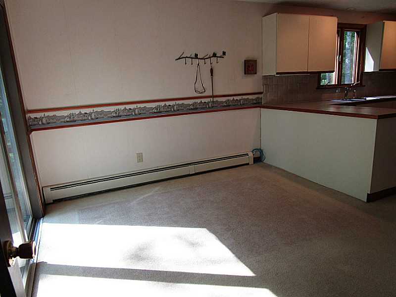 86 Bramble Bush Road Coventry, RI 02816 - Photo 9 of 25 Kitchen. EAT IN AREA OF KITCHEN WITH SLIDER TO DECK