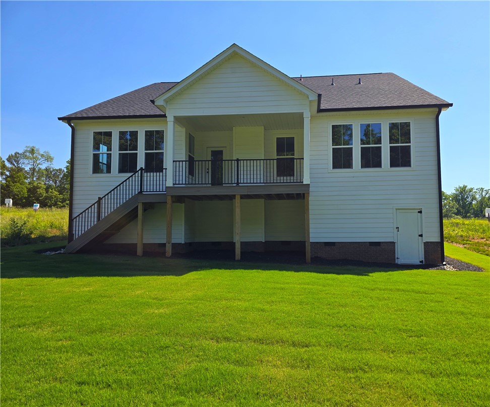 334 Summerall Drive Anderson, SC 29621 - Photo 18 of 28 Enjoy outdoor living with a spacious deck and stairs to a lush, green yard.