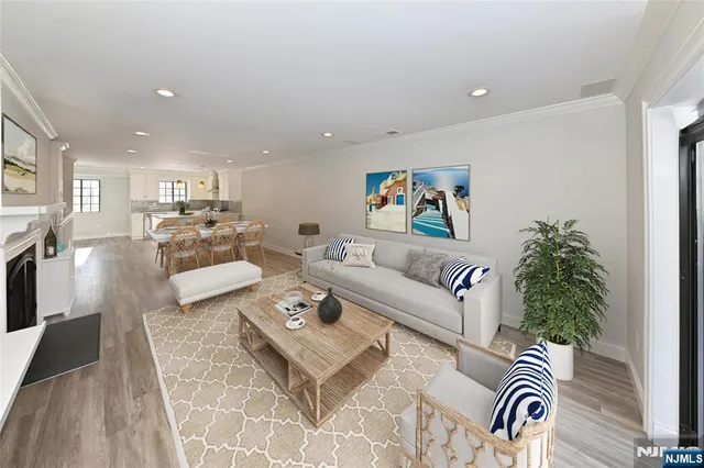 a living room with furniture and a rug