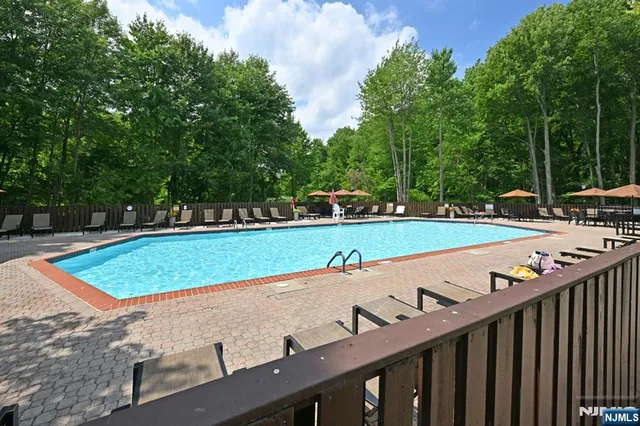 a view of a swimming pool with a backyard
