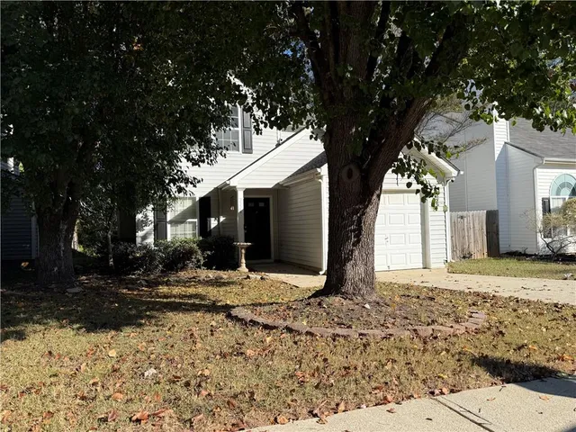 a view of empty room with a fireplace