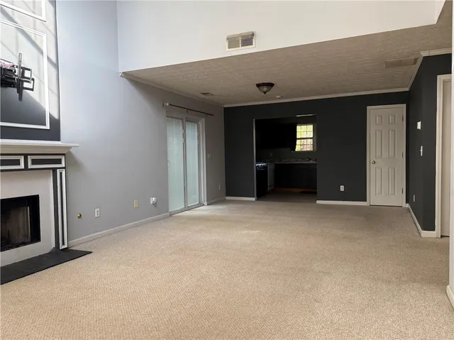 a kitchen with granite countertop cabinets stainless steel appliances and a sink