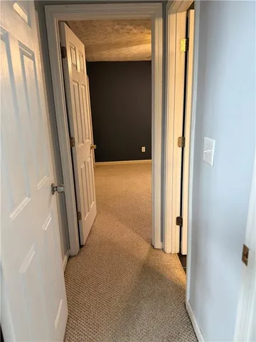 a bathroom with a toilet a sink and shower