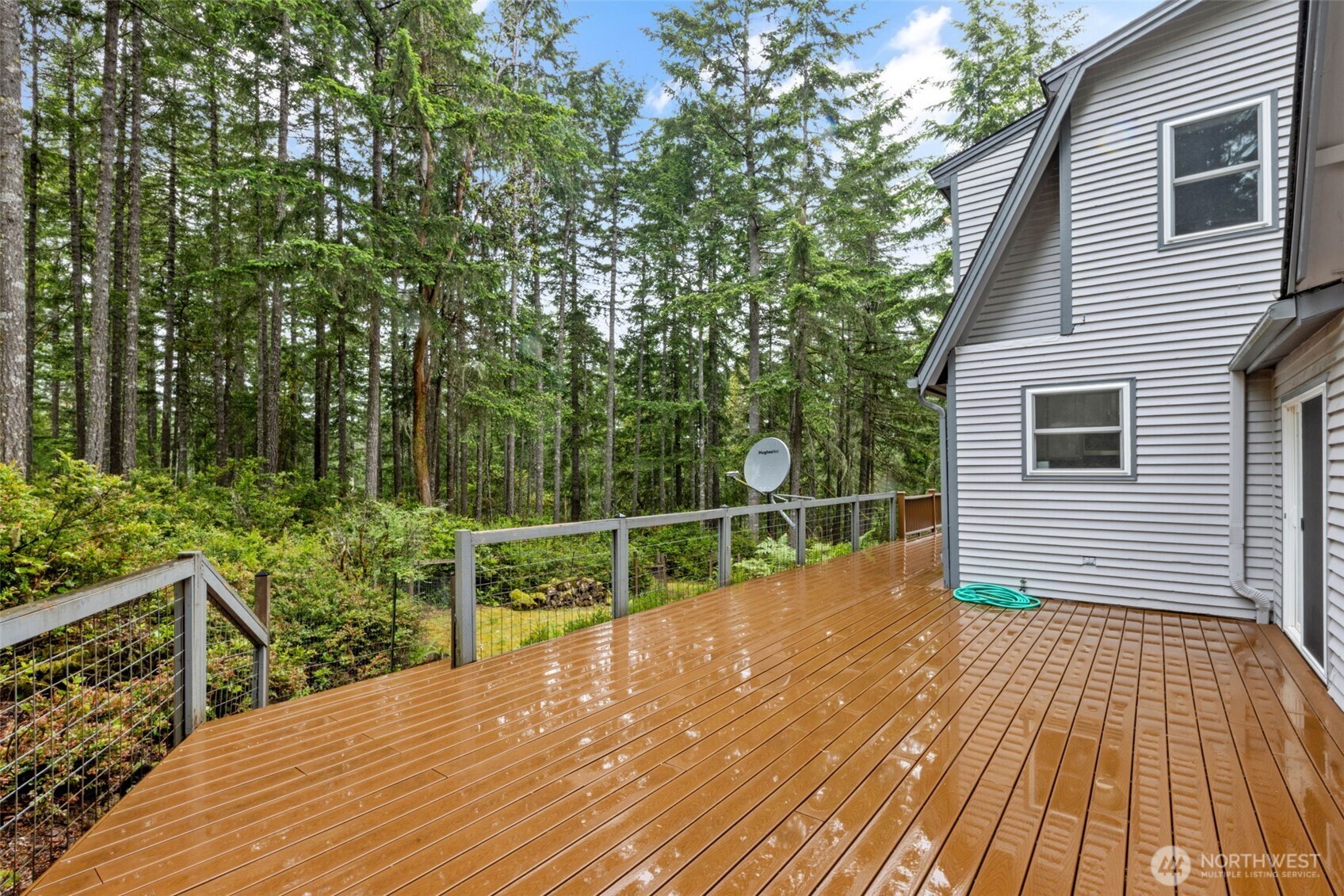 100 East Twanoh Heights Road South Belfair, WA 98528 - Photo 30 of 40 a view of a balcony with wooden floor and fence