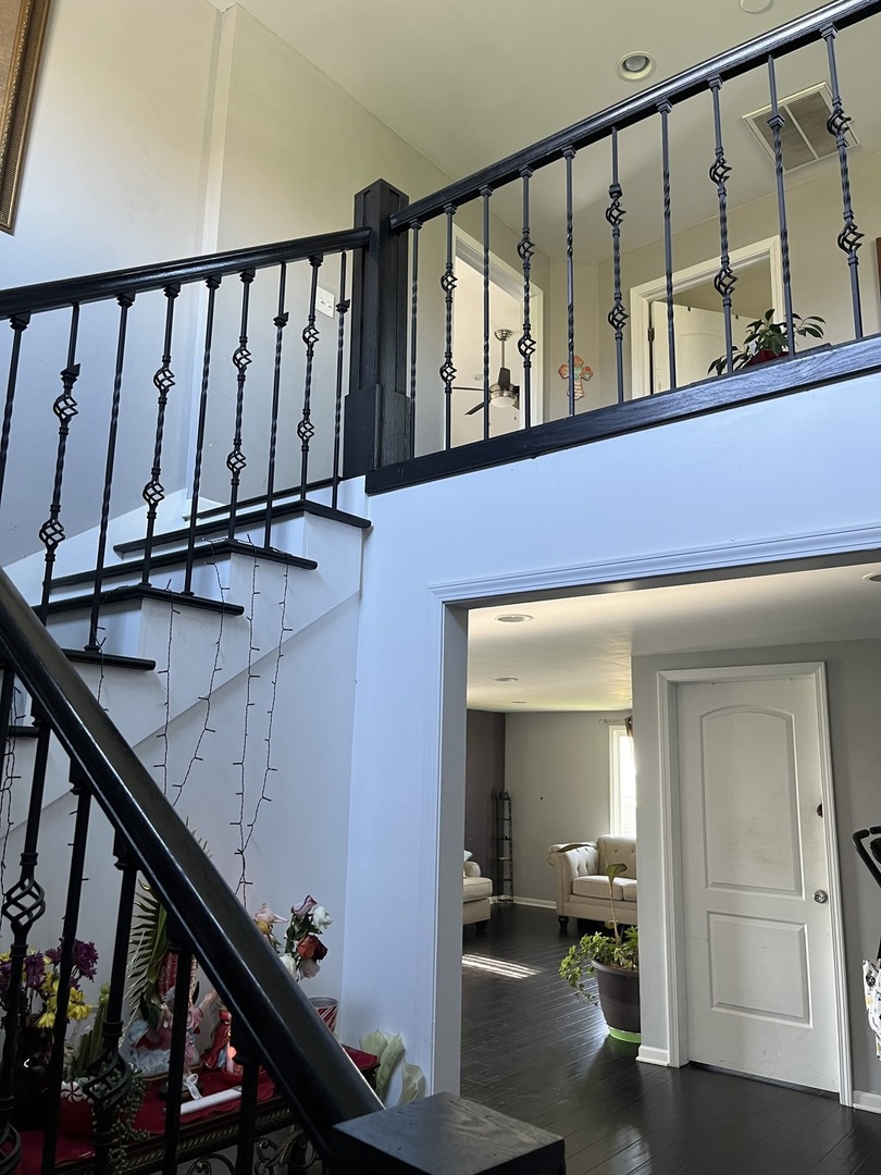 67 North 37th Road Mendota, IL 61342 - Photo 4 of 19 a view of staircase with lots of frames on wall