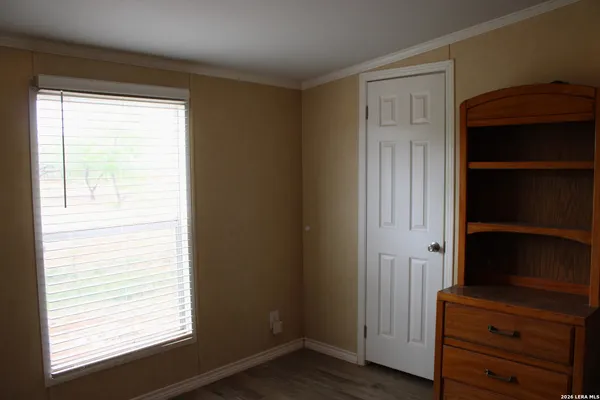 a view of front door with wooden floor