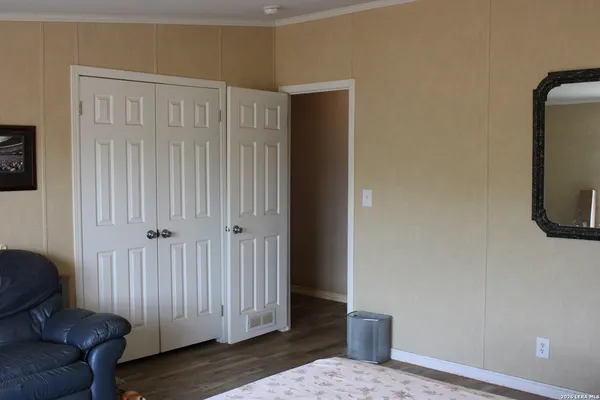 a view of a livingroom with furniture and wooden floor