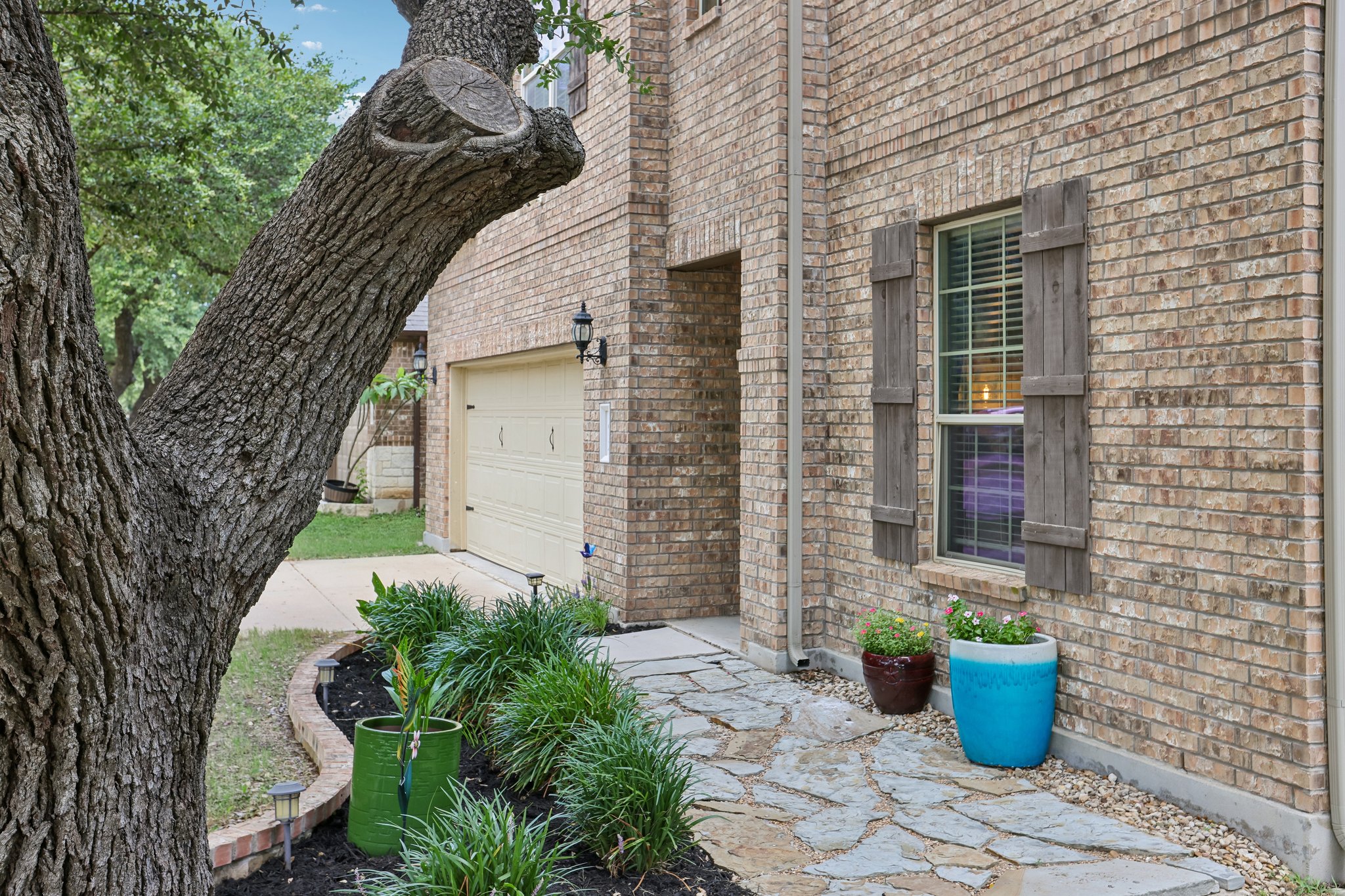 1924 Granite Springs Road Leander, TX 78641 - Photo 2 of 36 A classic brick exterior, complete with inviting entryway and attached garage.