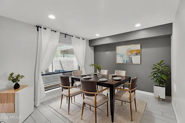 an empty room with a fireplace and a window