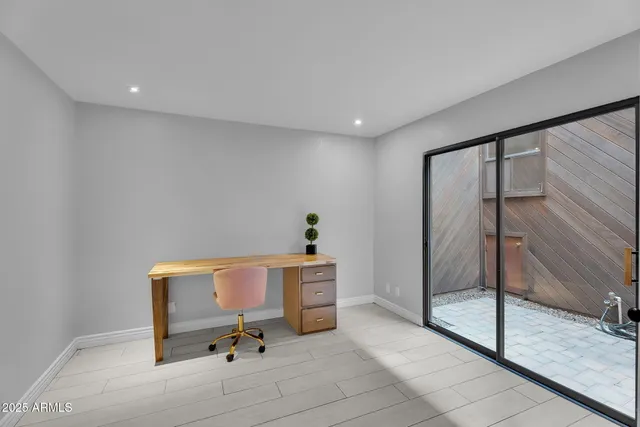 a view of an empty room with a fireplace