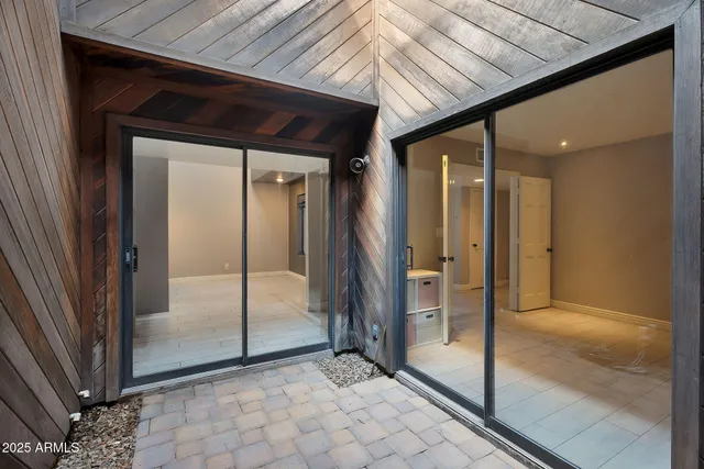 a view of an entryway with wooden floor