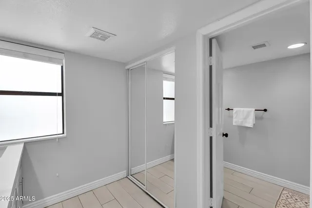 a view of a house with swimming pool and sitting area