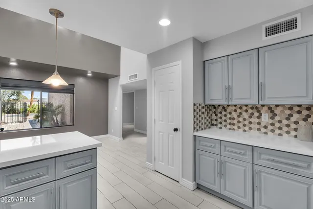 a living room with furniture a fireplace with wooden floor