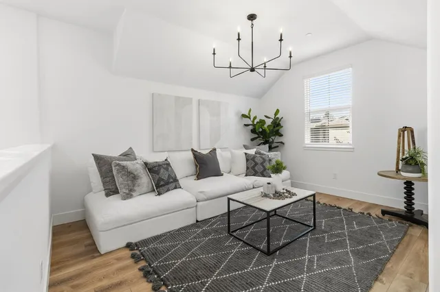 a view of backyard with outdoor seating and plants