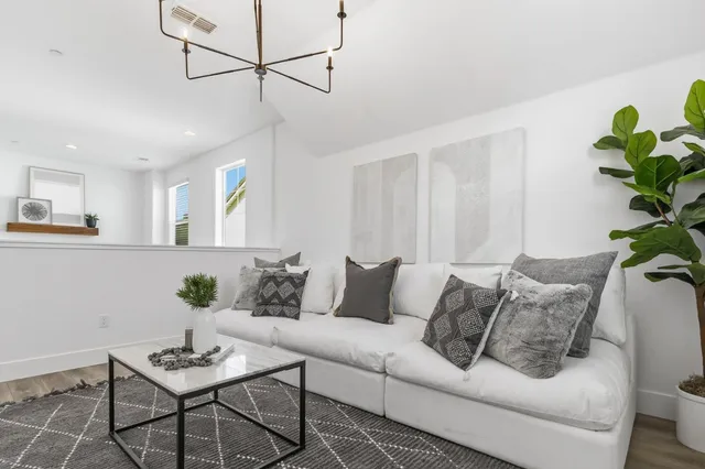 a view of a patio with a table and chairs