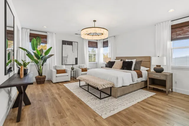 a backyard of a house with lots of green space and plants