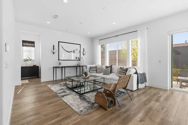 a kitchen with stainless steel appliances granite countertop a refrigerator and a stove