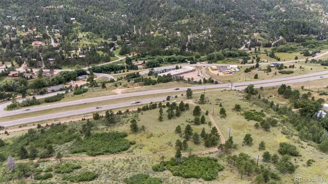 a view of a yard with wooden fence