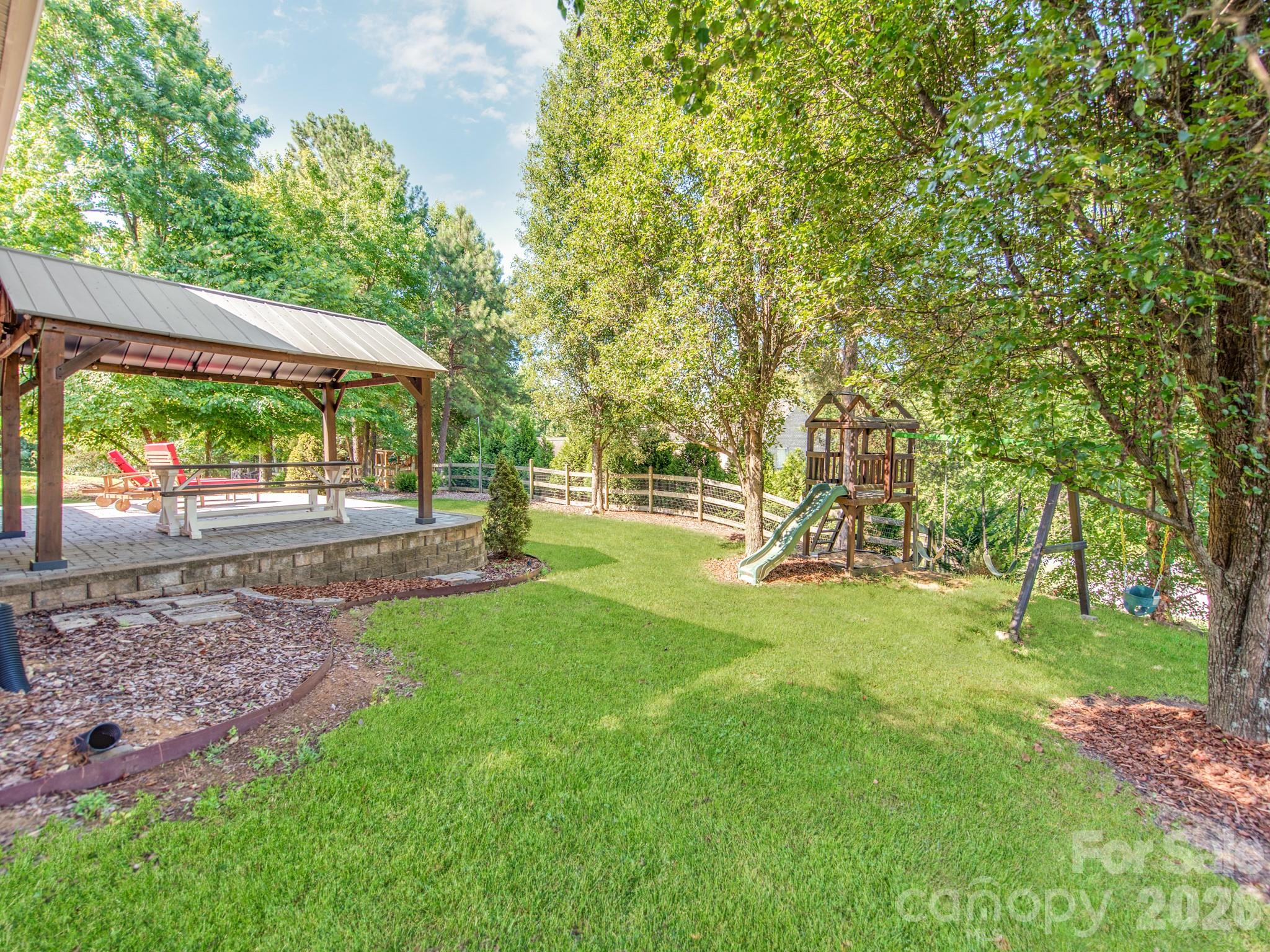 783 Sloan Street Denver, NC 28037 - Photo 33 of 44 a view of yard with deck and a garden