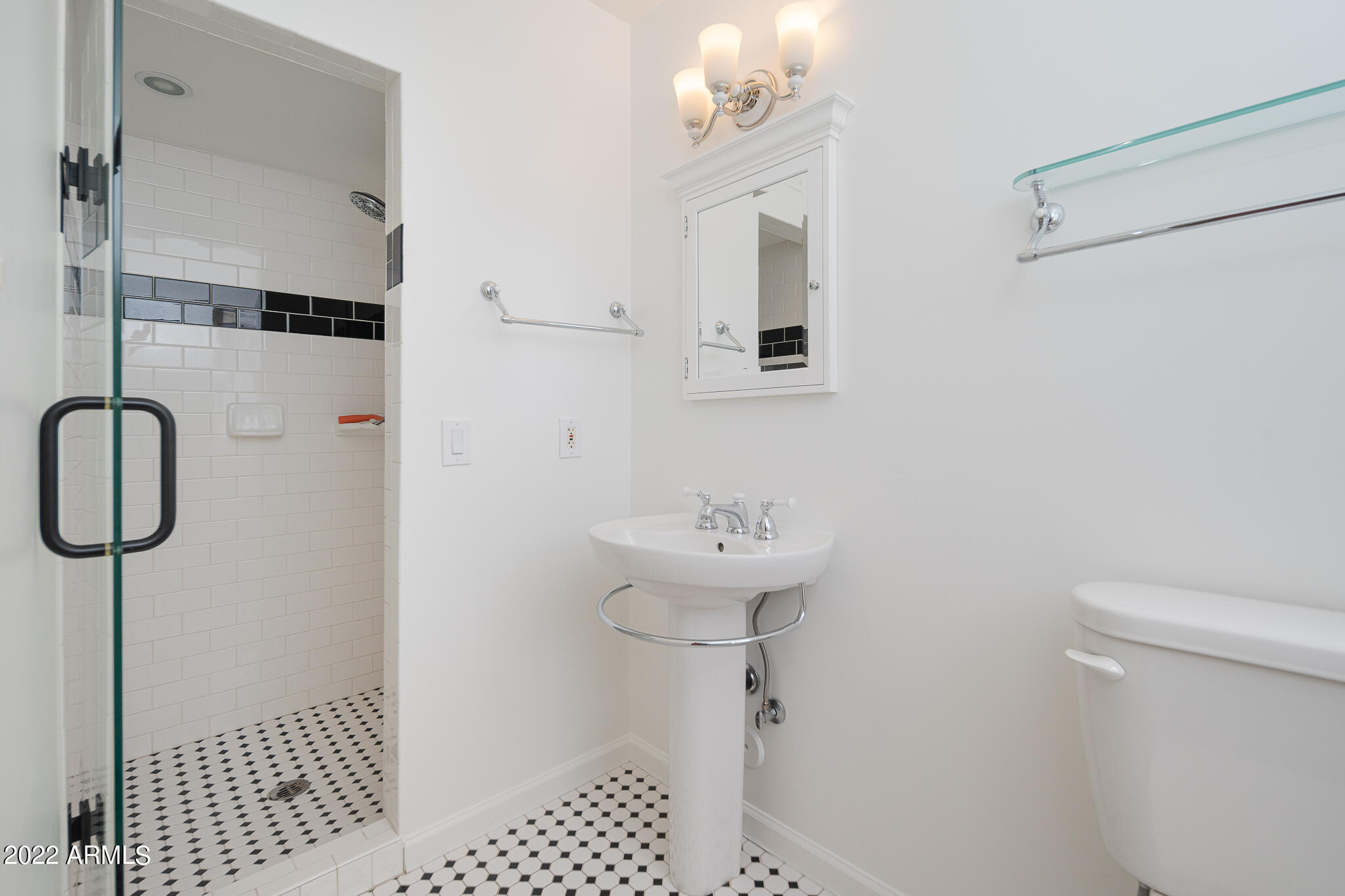 3864 North 50th Street Phoenix, AZ 85018 - Photo 12 of 15 a bathroom with a sink a toilet and shower