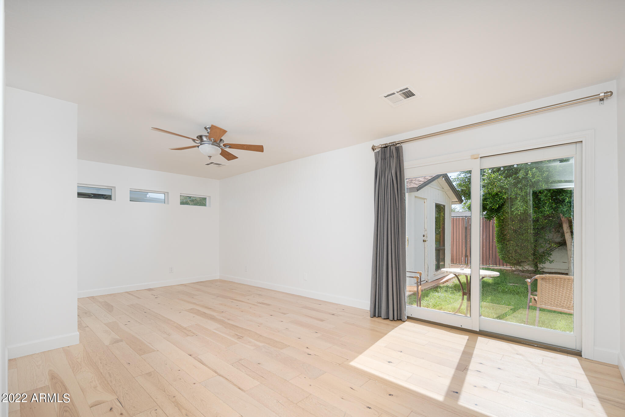 3864 North 50th Street Phoenix, AZ 85018 - Photo 9 of 15 a view of a room with a sliding door