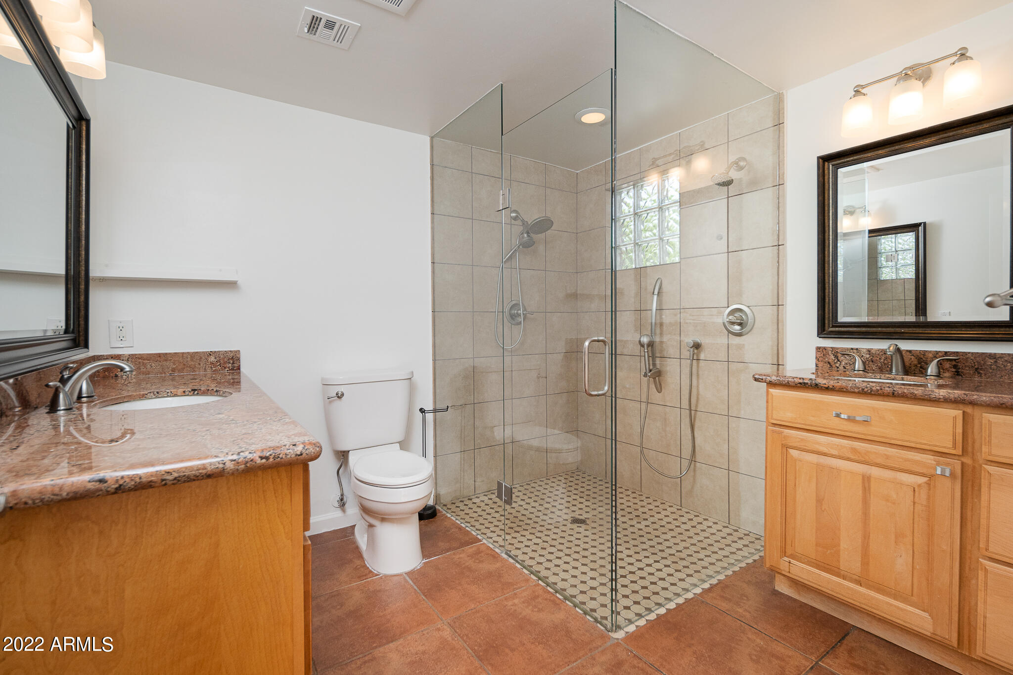 3864 North 50th Street Phoenix, AZ 85018 - Photo 10 of 15 a bathroom with a granite countertop sink toilet and shower