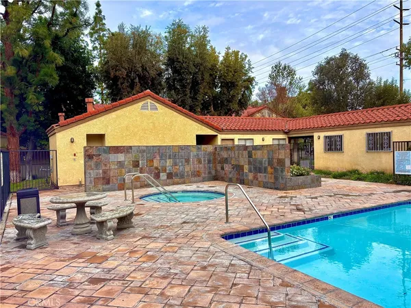 a view of a backyard with sitting area