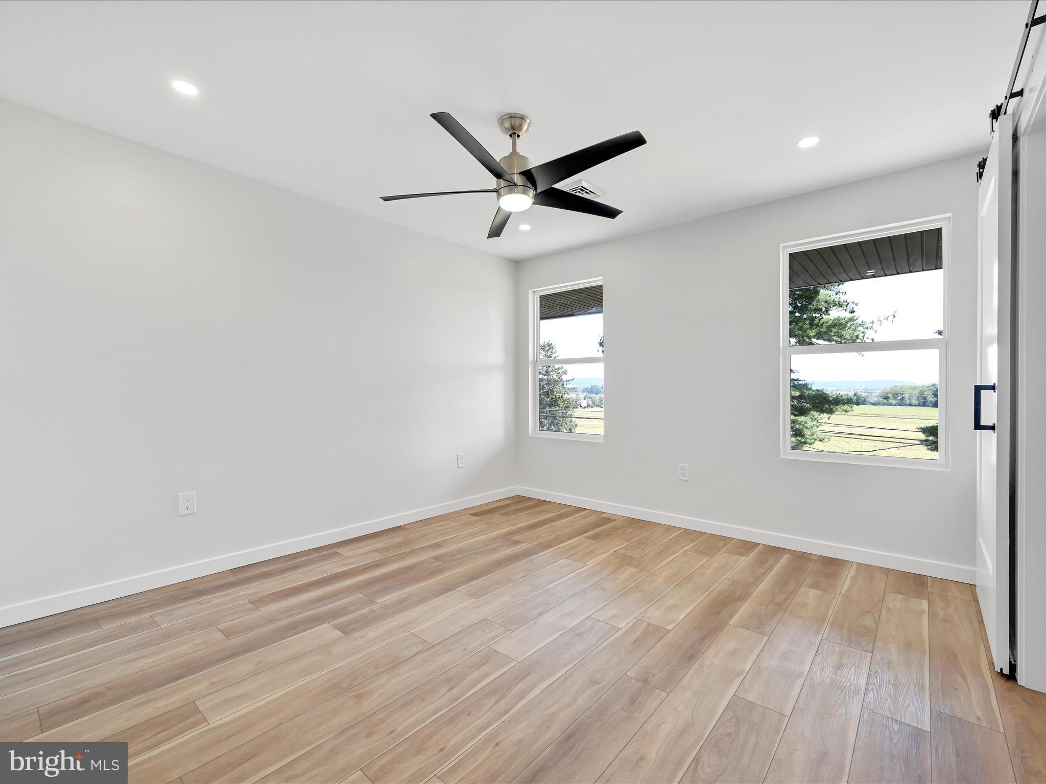 1056 West Leesport Road Leesport, PA 19533 - Photo 13 of 30 wooden floor in an empty room with a window