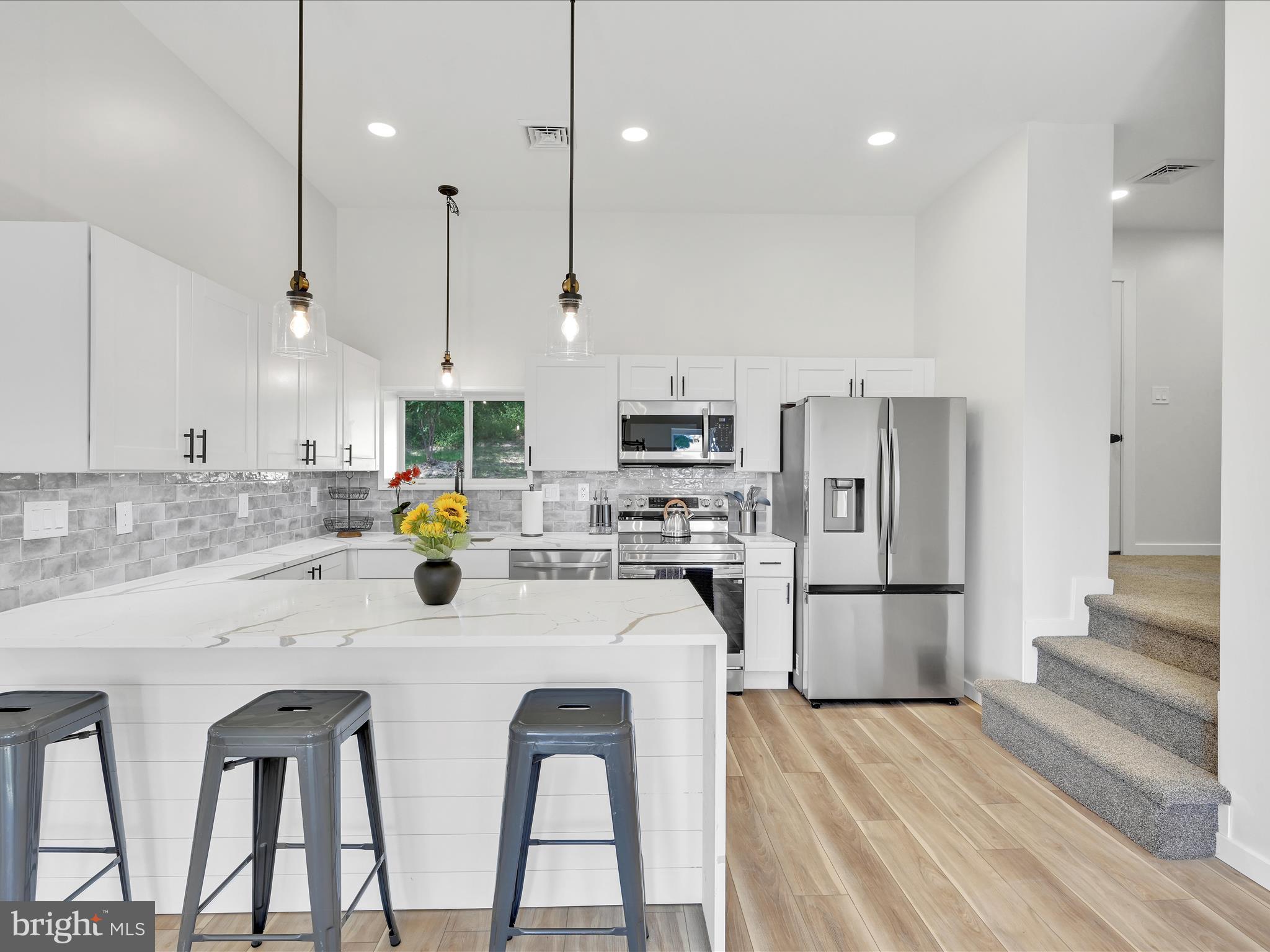 1056 West Leesport Road Leesport, PA 19533 - Photo 5 of 30 a kitchen with white cabinets and stainless steel appliances