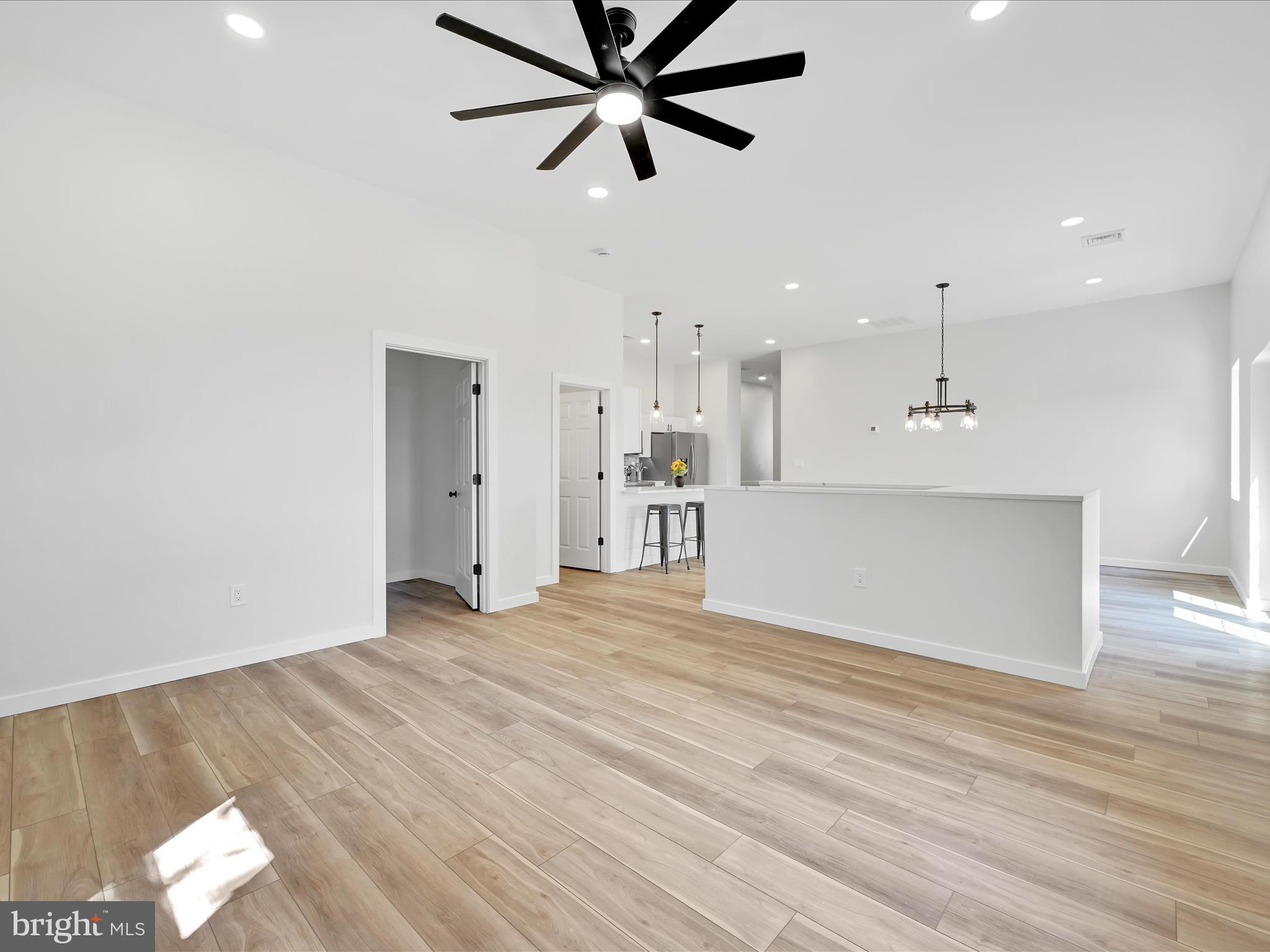 1056 West Leesport Road Leesport, PA 19533 - Photo 8 of 30 a view of a kitchen with wooden floor and a ceiling fan
