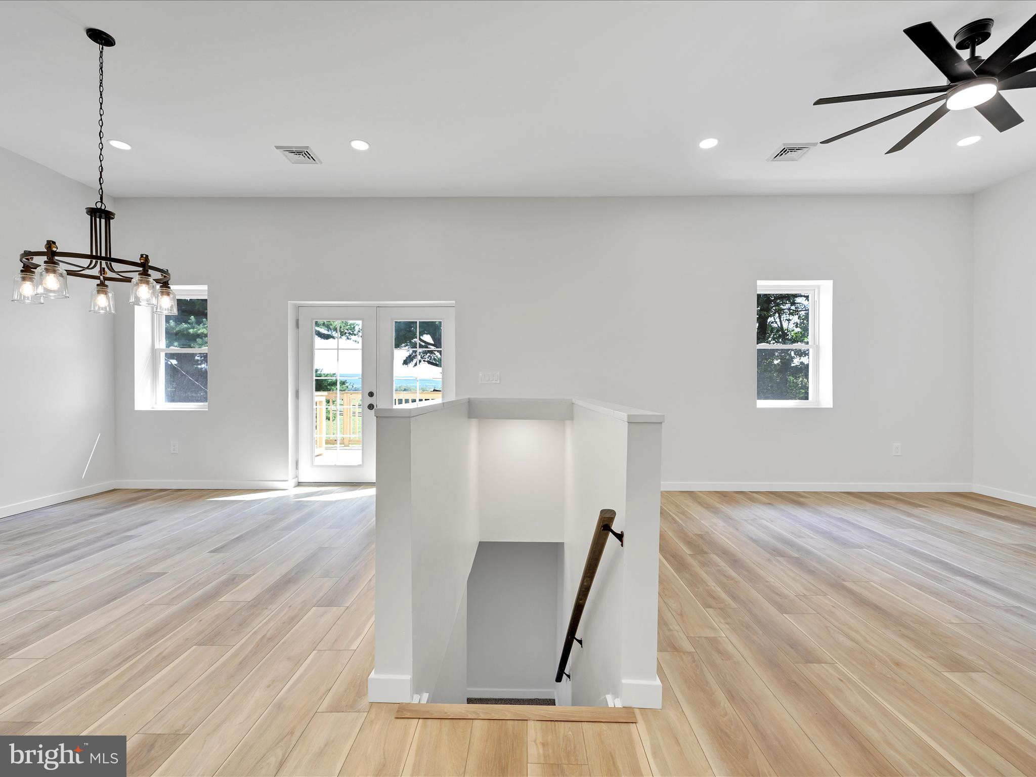 1056 West Leesport Road Leesport, PA 19533 - Photo 9 of 30 a view of a livingroom with wooden floor and a ceiling fan