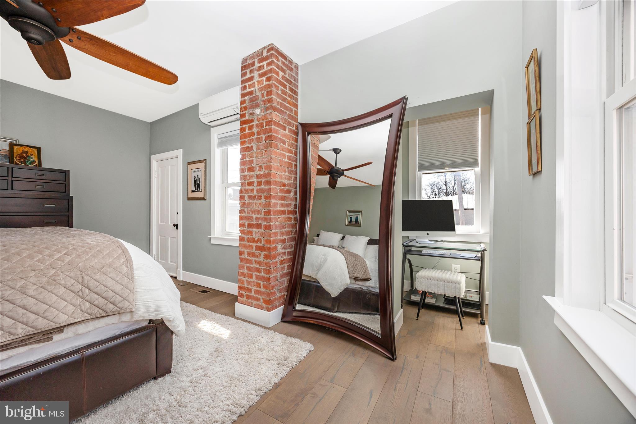 8 1/2 West 5th Street Frederick, MD 21701 - Photo 33 of 62 a bedroom with a bed and a mirror