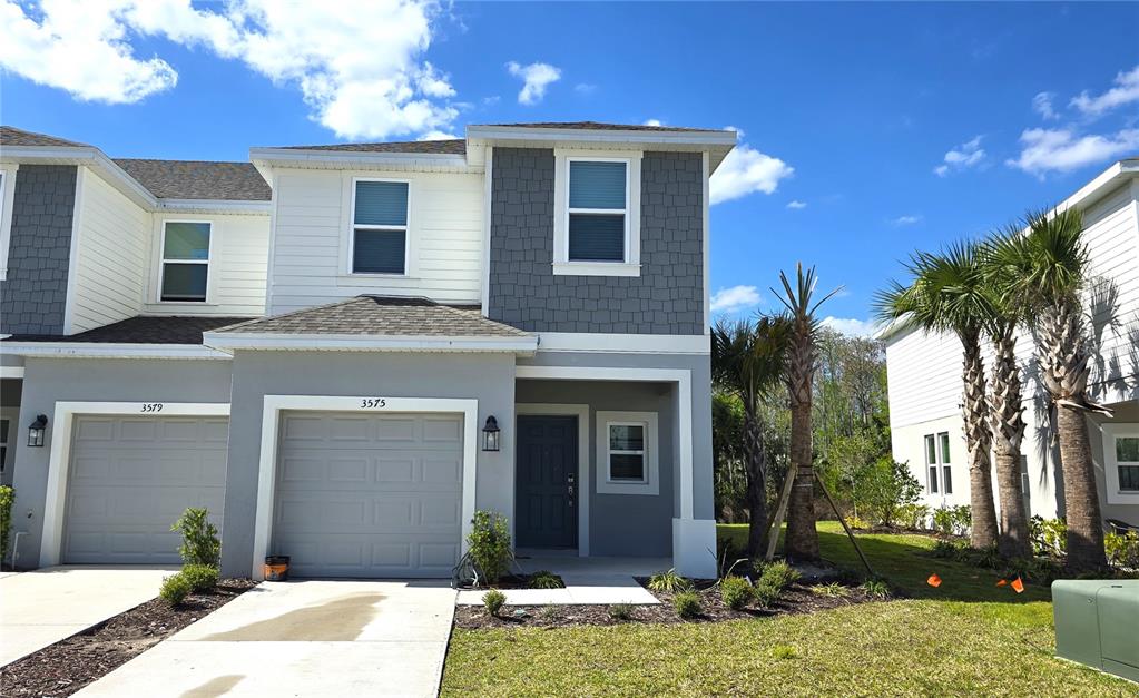 3575 Mayfair Street Kissimmee, FL 34758 - Photo 1 of 34 a front view of a house with garden