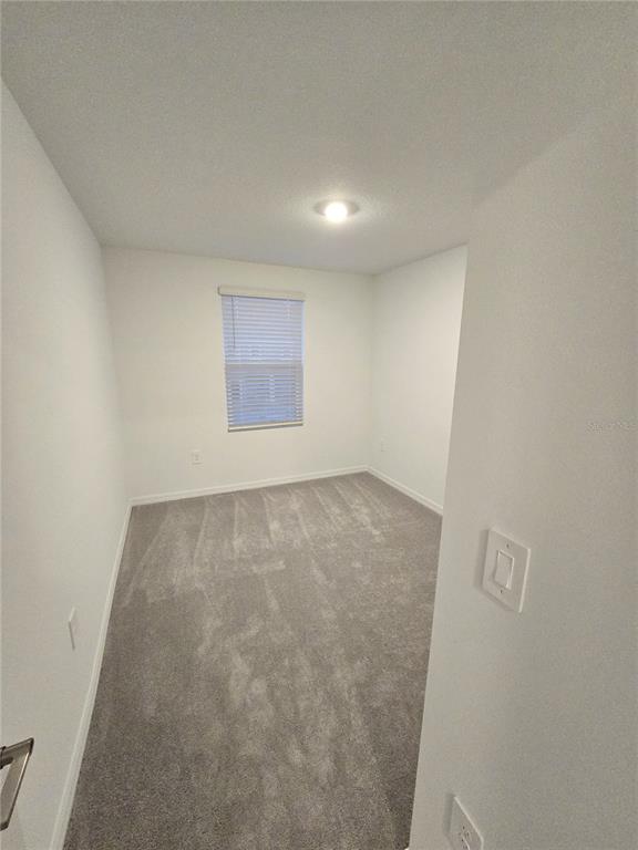 3575 Mayfair Street Kissimmee, FL 34758 - Photo 15 of 34 an empty room with a natural light