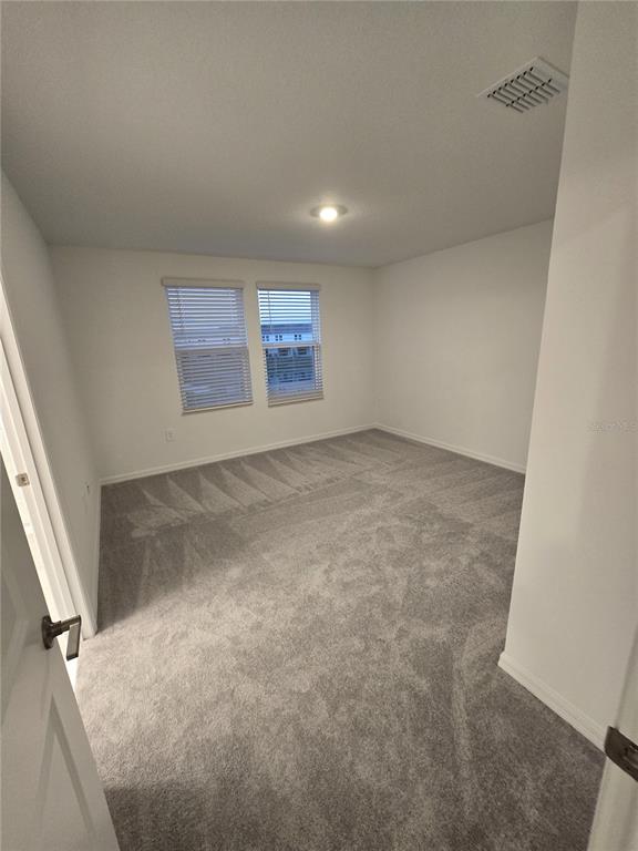 3575 Mayfair Street Kissimmee, FL 34758 - Photo 18 of 34 an empty room with windows