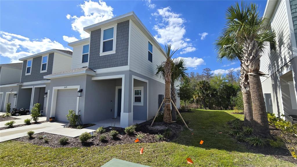 3575 Mayfair Street Kissimmee, FL 34758 - Photo 4 of 34 a view of a house with backyard porch and sitting area