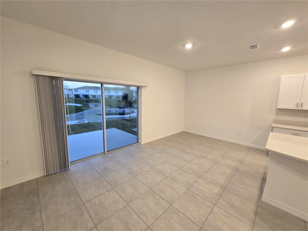 3575 Mayfair Street Kissimmee, FL 34758 - Photo 9 of 34 a view of an empty room with a window