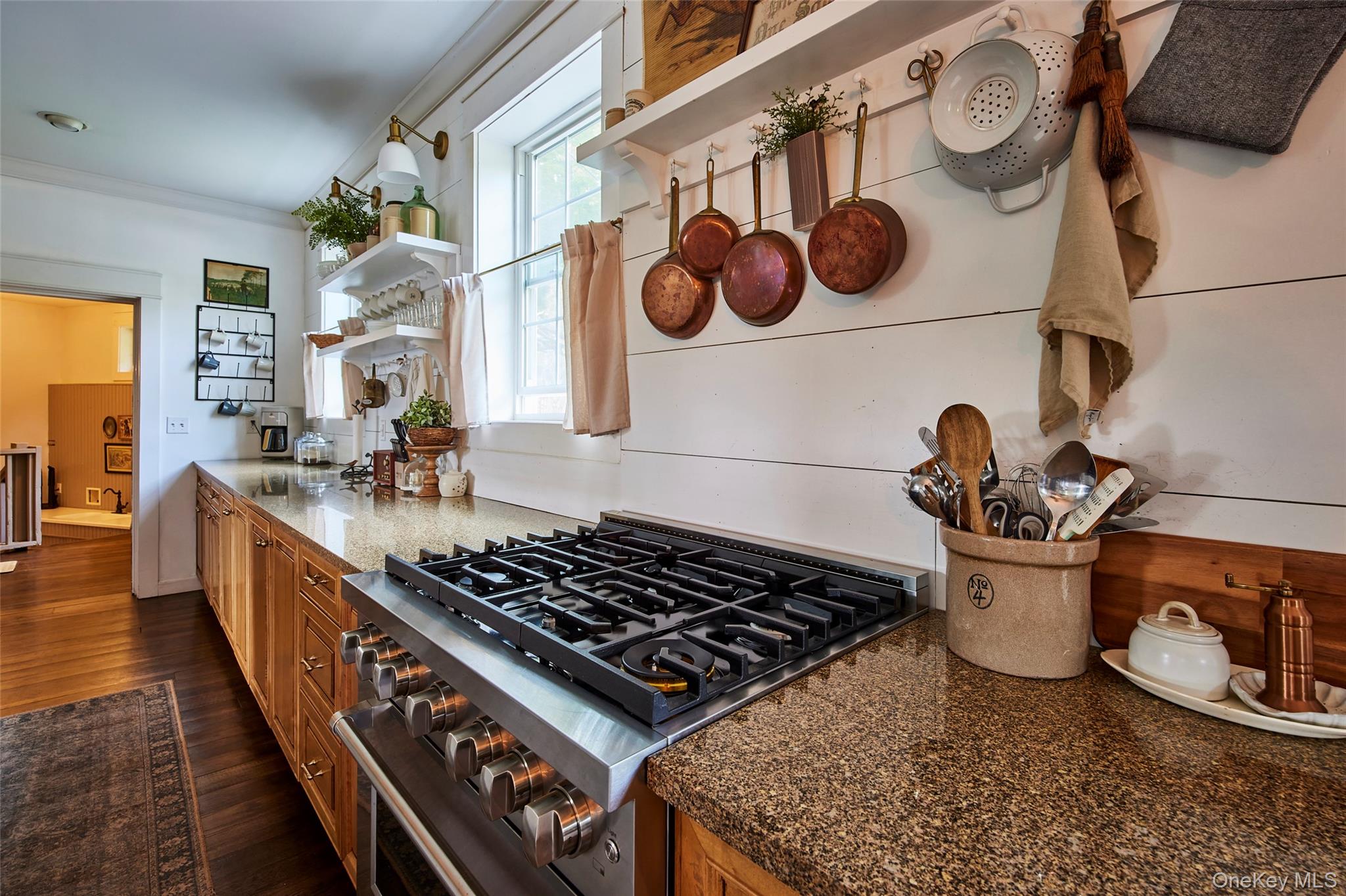 382 Benton Hollow Road Neversink, NY 12765 - Photo 21 of 48 a kitchen with a stove and a wooden floor
