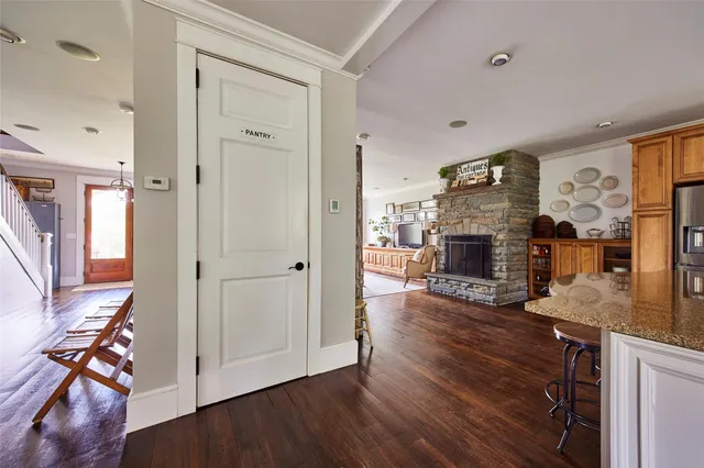 a living room with a fireplace and a window