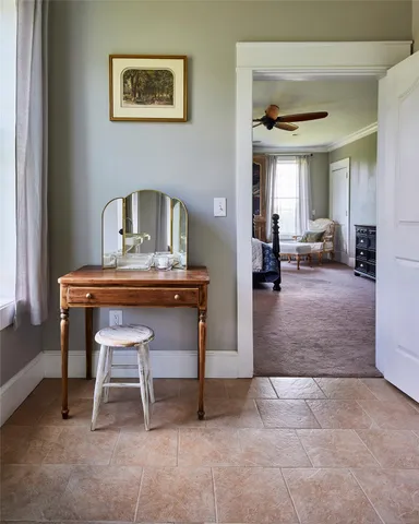 a view of a hallway with wooden floor