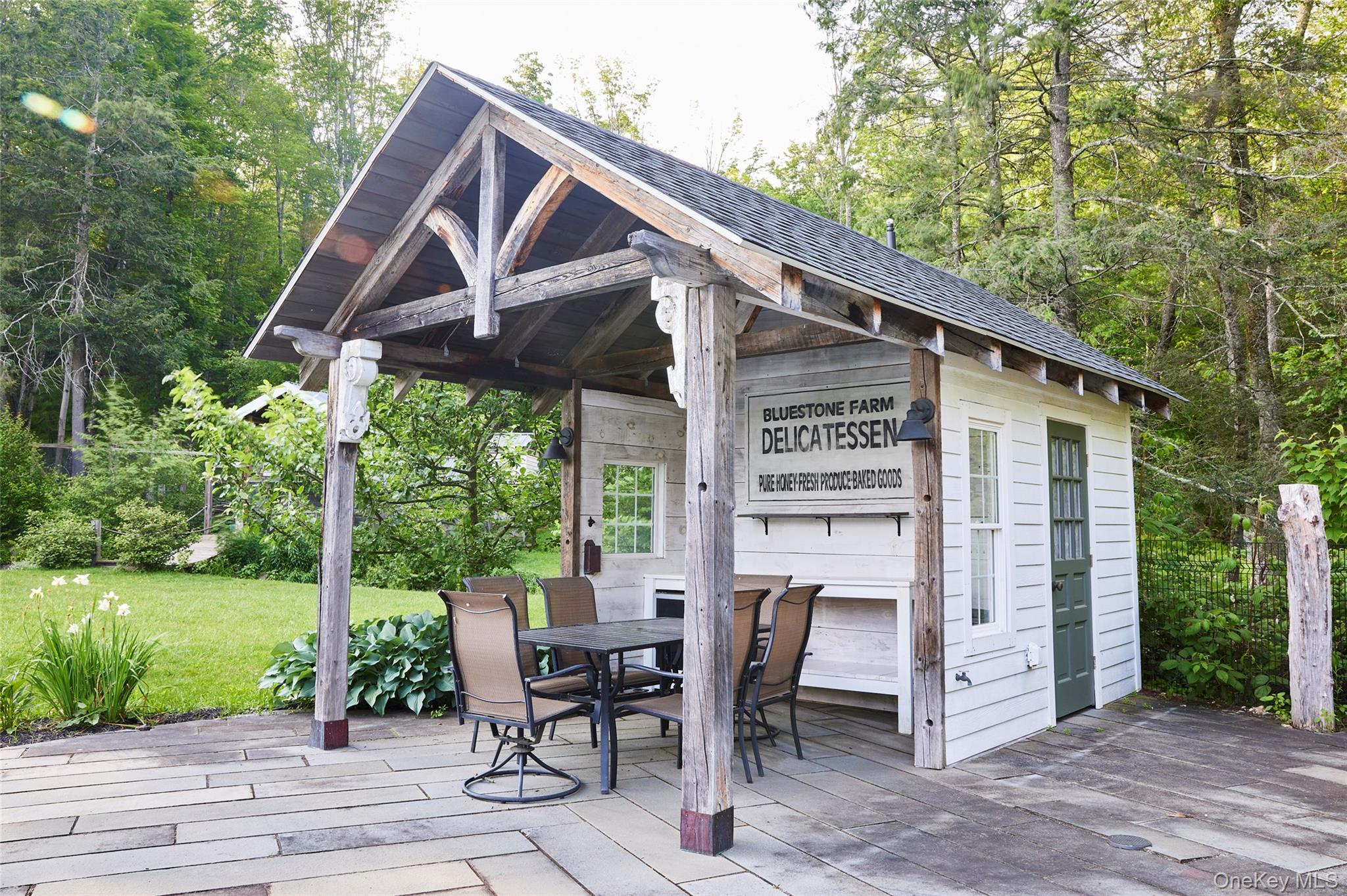 382 Benton Hollow Road Neversink, NY 12765 - Photo 43 of 48 a view of a patio with a table chairs and a yard