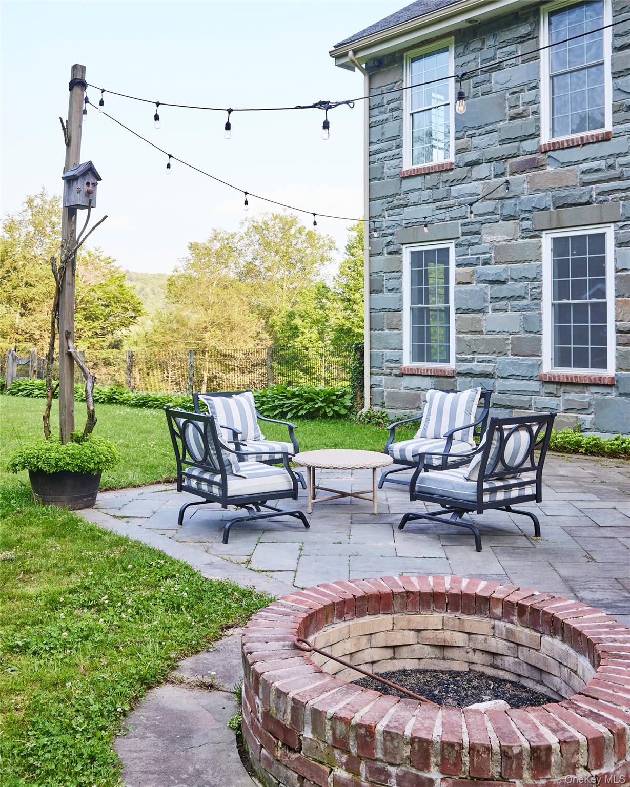 382 Benton Hollow Road Neversink, NY 12765 - Photo 45 of 48 a view of a patio with a table chairs and a yard