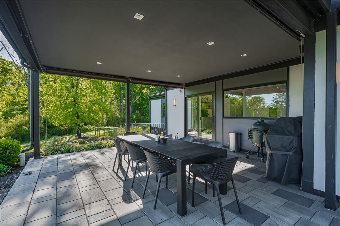 1506 Pleasant View Road Coopersburg, PA 18036 - Photo 83 of 97 An inviting outdoor space features a covered patio perfect for al fresco dining amidst lush greenery.