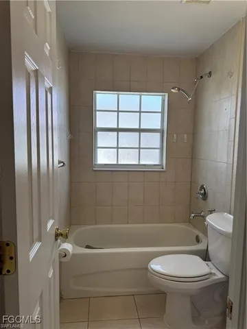 a bathroom with a toilet a sink and bathtub