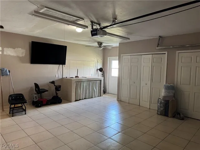 a bed room with a bed and a television