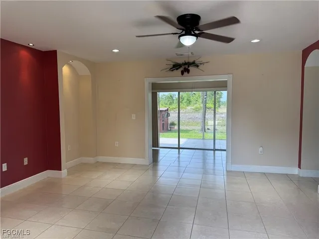 a view of an empty room with a fan