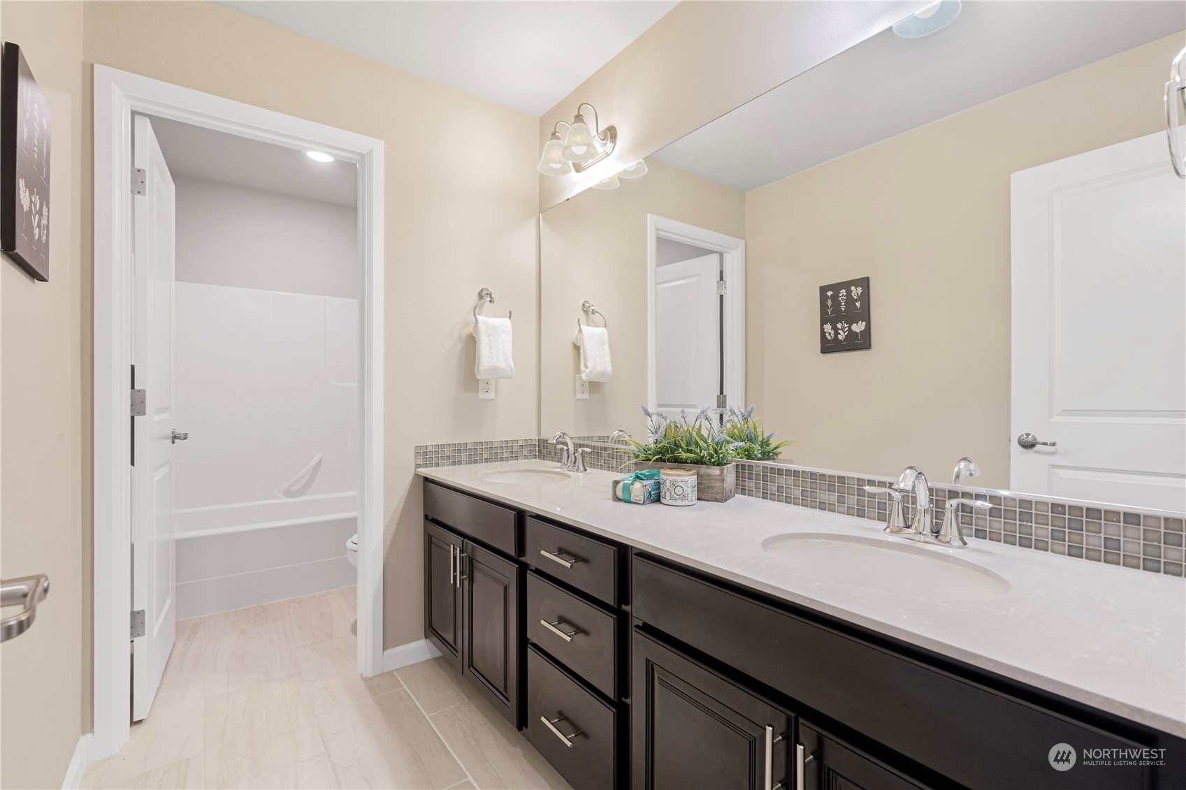 21311 42nd Avenue Southeast Bothell, WA 98021 - Photo 15 of 24 a bathroom with a granite countertop sink double vanity and a mirror