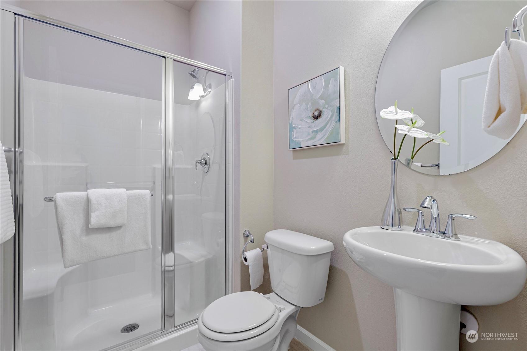 21311 42nd Avenue Southeast Bothell, WA 98021 - Photo 18 of 24 a white toilet sitting next to a bathroom sink